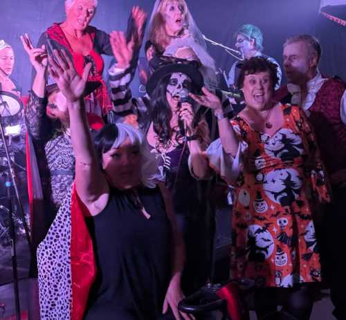 Guests mingle at the Halloween party