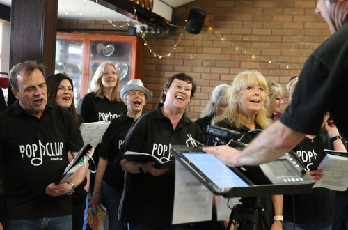 Happy choir members at rehearsal